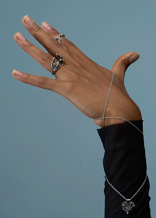 Close-up of Indigo artisan jewelry, an intimate echo transformed into precious silver form